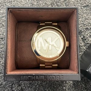 Gently used Michael Kors gold oversized woman’s watch